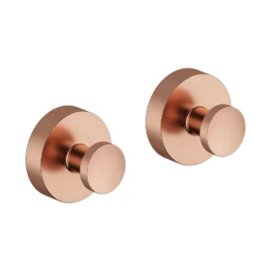 Zen håndklekrok med rosett i børstet kobber – unik og elegant detalj.